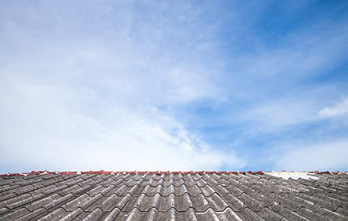 Asbestos roof against sky